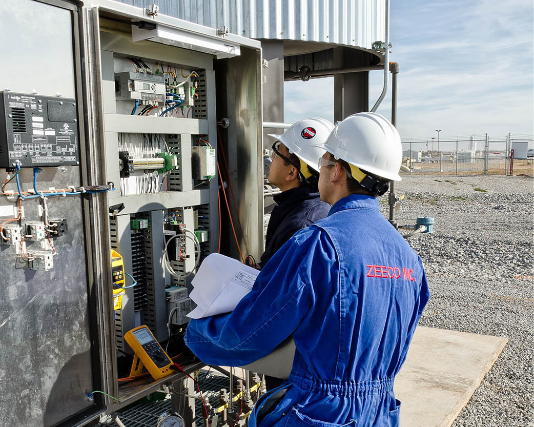 Workers inspecting equipment