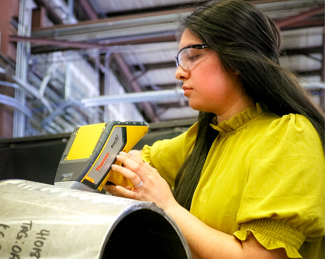 Worker inspecting equipment