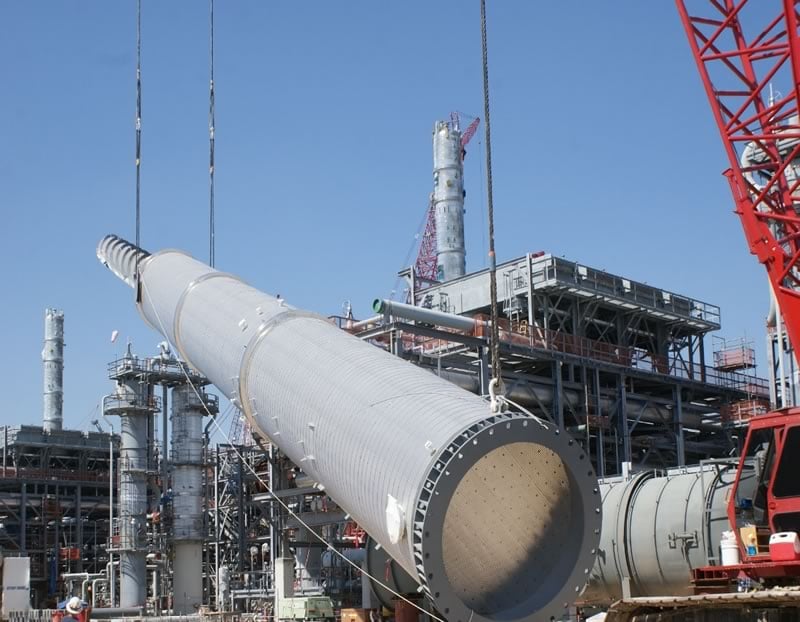 Crane lifting a Vent Stack into place 